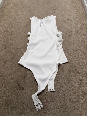 Ribbed White Side-Tie Bodysuit with Snap Closure